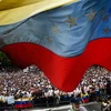 Những người ủng hộ lực lượng đối lập Venezuela tuần hành phản đối Chính phủ tại thủ đô Caracas ngày 23/1/2019. (Ảnh: AFP/TTXVN)