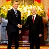 Tổng Bí thư, Chủ tịch nước Nguyễn Phú Trọng đón Tổng thống Argentina Mauricio Macri. (Ảnh: Trí Dũng/TTXVN)