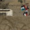 Quốc kỳ Syria được treo gần khu định cư Ein Zivan trên Cao nguyên Golan năm 2018. (Nguồn: AFP/TTXVN)