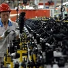 Công nhân làm việc tại một nhà máy ở Trung Quốc. (Nguồn: AFP)