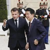 Tổng thống Pháp Emmanuel Macron và Thủ tướng Nhật Bản Shinzo Abe. (Nguồn: Kyodo)