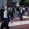 Người dân di chuyển trên đường phố Tokyo, Nhật Bản. (Ảnh: AFP/TTXVN)