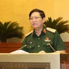 Đại tướng Ngô Xuân Lịch, Bộ trưởng Bộ Quốc phòng giải trình ý kiến của đại biểu Quốc hội. (Ảnh: Doãn Tấn/TTXVN)