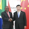 Chủ tịch Trung Quốc Tập Cận Bình và Tổng thống Cyril Ramaphosa bên lề Hội nghị thượng đỉnh G20 diễn ra tại Nhật Bản. (Nguồn: Xinhua)