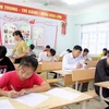 Thí sinh dự thi tại điểm thi Trường Trung học phổ thông Than Uyên, huyện Than Uyên tỉnh Lai Châu. (Ảnh: Quý Trung/TTXVN)