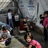 Người di cư tại trại di trú Moria trên đảo Lesbos, Hy Lạp. (Ảnh: AFP/TTXVN)