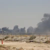 Khói bốc lên từ nhà máy lọc dầu của Aramco ở Abqaiq, Saudi Arabia, sau vụ tấn công ngày 14/9/2019. (Ảnh: AFP/TTXVN)