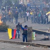 Biểu tình phản đối chính sách khắc khổ của chính phủ tại Quito, Ecuador, ngày 8/10. (Ảnh: AFP/TTXVN)