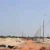 Hệ thống đường giao thông và cột điện đang được xây dựng trong khu tái định cư Hải Khê. (Ảnh: Nguyên Lý/TTXVN)