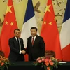 Tổng thống Pháp Emmanuel Macron (trái) và Chủ tịch Trung Quốc Tập Cận Bình tại cuộc gặp ở Bắc Kinh ngày 6/11/2019. (Ảnh: AFP/TTXVN)
