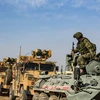 Xe quân sự Nga và Thổ Nhĩ Kỳ tuần tra tại thị trấn Darbasiyah, tỉnh Hasakeh, biên giới Syria-Thổ Nhĩ Kỳ, ngày 1/11/2019. (Ảnh: AFP/TTXVN)