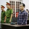 Bị cáo Trần Đình Trung tại phiên tòa. (Ảnh: Thanh Tân/TTXVN)