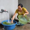 Người dân sử dụng nguồn nước sạch phục vụ sinh hoạt hàng ngày. (Ảnh minh họa. Việt Dũng/TTXVN)