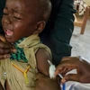 Tiêm vắcxin cho trẻ em. (Nguồn: AFP)