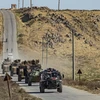 Đoàn xe quân sự của Nga và Thổ Nhĩ Kỳ tham gia tuần tra chung gần thị trấn Al-Muabbadah, tỉnh Hasakeh, Đông Bắc Syria ngày 8/11/2019. (Ảnh: AFP/TTXVN)