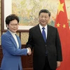 Chủ tịch Trung Quốc Tập Cận Bình (phải) trong cuộc gặp Trưởng Đặc khu hành chính Hong Kong Lâm Trịnh Nguyệt Nga tại Bắc Kinh (Trung Quốc) ngày 16/12/2019. (Ảnh: THX/TTXVN)