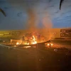 Xe ôtô bốc cháy sau vụ không kích do Mỹ tiến hành tại sân bay quốc tế thủ đô Baghdad, Iraq, ngày 3/1/2020. (Ảnh: AFP/TTXVN)