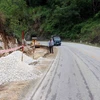 Một điểm cong cua tiềm ẩn tai nạn giao thông trên Quốc Lộ 2C, địa phận xã Phúc Ứng, huyện Sơn Dương (Tuyên Quang) đang được xử lý mở rộng đường. (Ảnh Quang Đán/TTXVN)