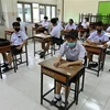 Học sinh và giáo viên đeo khẩu trang phòng lây nhiễm COVID-19 tại một trường học ở Bangkok, Thái Lan. (Ảnh: AFP/TTXVN)