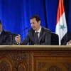 Tổng thống Syria Bashar al-Assad (giữa) chủ trì cuộc họp với các thành viên đảng Baath cầm quyền tại Damascus. (Ảnh: AFP/TTXVN)