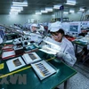 Dây chuyền kiểm tra bảng mạch điện tử tại một doanh nghiệp tại khu công nghiệp Yên Phong, Bắc Ninh. (Ảnh: Danh Lam/TTXVN)