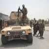 Lực lượng an ninh Afghanistan tham gia chiến dịch truy quét các tay súng Taliban tại huyện Alishing, tỉnh Laghman. (Ảnh: THX/TTXVN)
