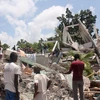 Khách sạn Manguier bị đổ sập sau trận động đất ở Les Cayes, Haiti, ngày 14/8. (Ảnh: AFP/TTXVN)