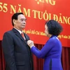 Trao Huy hiệu Đảng cho nguyên Thường trực Ban Bí thư Lê Hồng Anh
