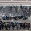 Hành khách ở Sân bay Midway, Chicago, Illinois, Mỹ. (Ảnh: AFP/TTXVN)
