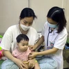 Bệnh nhi điều trị cúm tại Bệnh viện Sản Nhi tỉnh Ninh Bình. (Ảnh: Thùy Dung/TTXVN)