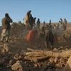 Người dân dọn dẹp đống đổ nát của ngôi nhà bị sập sau một trận động đất ở tỉnh Herat, Afghanistan năm 2023. (Ảnh: AFP/TTXVN)