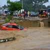 Cảnh tàn phá sau những trận mưa lớn tại Bingerville gần Abidjan, Côte d'Ivoire. (Ảnh: AFP/TTXVN)