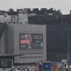 Tòa nhà trung tâm thương mại Crocus City Hall ở Moskva, Nga bị hư hại sau vụ tấn công khủng bố nhằm vào phòng hòa nhạc trong trung tâm, ngày 23/3/2024. (Ảnh: AFP/TTXVN)
