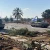 Xe tăng quân đội Israel tiến vào Gaza qua cửa khẩu Rafah ngày 7/5/2024. (Ảnh: THX/TTXVN)