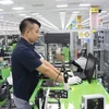 Công nhân Công ty TNHH Samsung Electronics Việt Nam, khu công nghiệp Yên Phong, tỉnh Bắc Ninh trong ca làm việc. (Ảnh: Thanh Thương/TTXVN)