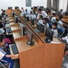 Giờ Tin học của học sinh tiểu học Trường Tiểu học Tân Thông, Củ Chi, thành phố Hồ Chí Minh. (Ảnh: Phương Vy/TTXVN)