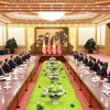 Thủ tướng Phạm Minh Chính hội kiến Tổng Bí thư, Chủ tịch Trung Quốc Tập Cận Bình. (Ảnh: Dương Giang/TTXVN)