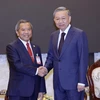 Chủ tịch nước Tô Lâm với Chủ tịch Hội Hữu nghị Lào-Việt Nam Boviengkham Vongdara. (Ảnh: Nhan Sáng/TTXVN)