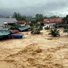 Lũ tràn công trình thuỷ lợi Hà Thanh, xã Đông Hải, huyện Tiên Yên, gây ngập lụt khu dân cư. (Ảnh: TTXVN phát)