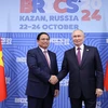 Thủ tướng Phạm Minh Chính với Tổng thống Liên bang Nga Vladimir Putin, Chủ tịch Nhóm BRICS năm 2024. (Ảnh: Dương Giang/TTXVN)