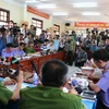 Quang cảnh buổi họp báo vụ án giết 6 người trong gia đình ở Bình Phước. (Ảnh: K'H/TTXVN)