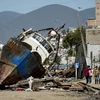 Thuyền đánh cá bị mắc cạn khi neo đậu ở cảng Coquimbo (Chile). (Nguồn: ibTimes)