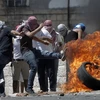 Người biểu tình bạo động Palestine trong xung đột với binh sĩ Israel ở Shuafat, khu vực lân cận Jerusalem. (Nguồn: AFP/TTXVN) 
