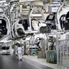Dây chuyền sản xuất xe hơi bên trong nhà máy của hãng Volkswagen ở Wolfsburg, Đức. (Nguồn: AFP/TTXVN) 