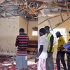 Hiện trường vụ đánh bom ở Maiduguri ngày 23/10. (Nguồn: AFP/TTXVN)