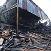 Hiện trường vụ cháy tại tầng 3 ngôi nhà nhiều máy móc và đồ gỗ bị thiêu rụi. (Ảnh: Trần Lê Lâm/TTXVN) 