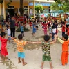 Giờ học thể dục ngoài trời của các cháu ở Trường Mầm non xã Nhâm, huyện miền núi A Lưới. (Ảnh: Hồ Cầu/TTXVN) 