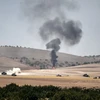 Khói bốc lên sau các vụ nã pháo của quân đội Thổ Nhĩ Kỳ từ khu vực Gaziantep, giáp giới Syria ngày 24/8. (Nguồn: AFP/TTXVN) 