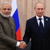 Tổng thống Nga Vladimir Putin (phải) có cuộc gặp Thủ tướng Ấn Độ Narendra Modi (trái). (Nguồn: AFP/TTXVN)
