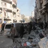 Người dân Syria đợi sơ tán khỏi Aleppo ngày 15/12. (Nguồn: EPA/TTXVN) 